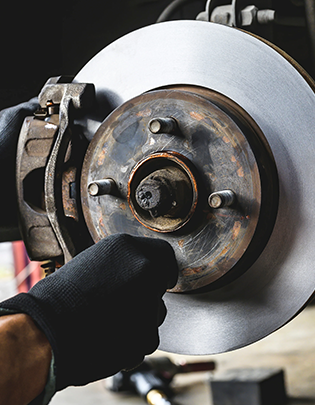 Automotive brake discs, callipers, and brake pads manufactured at an Indian components factory