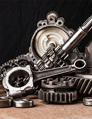 Precision-machined engine components including pistons and crankshafts sourced from India