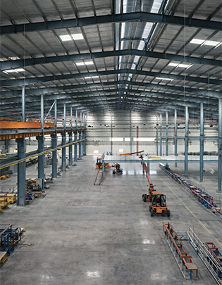 Steel-framed factory building with wide-span structure designed for manufacturing plant use
