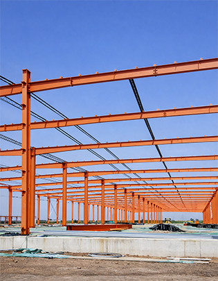 Multi-span steel building with colour-coated roof sheets and continuous column row design