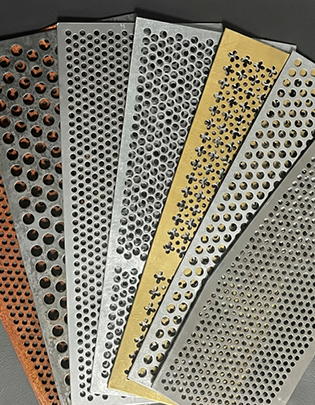 Stacked perforated sheet metal panels with uniform round hole patterns from an Indian factory